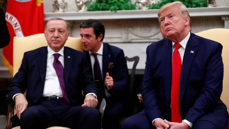 Turkish President Tayyip Erdogan listens as he meets with US President Donald Trump in the Oval Office of the White House in Washington, US, November 13, 2019.