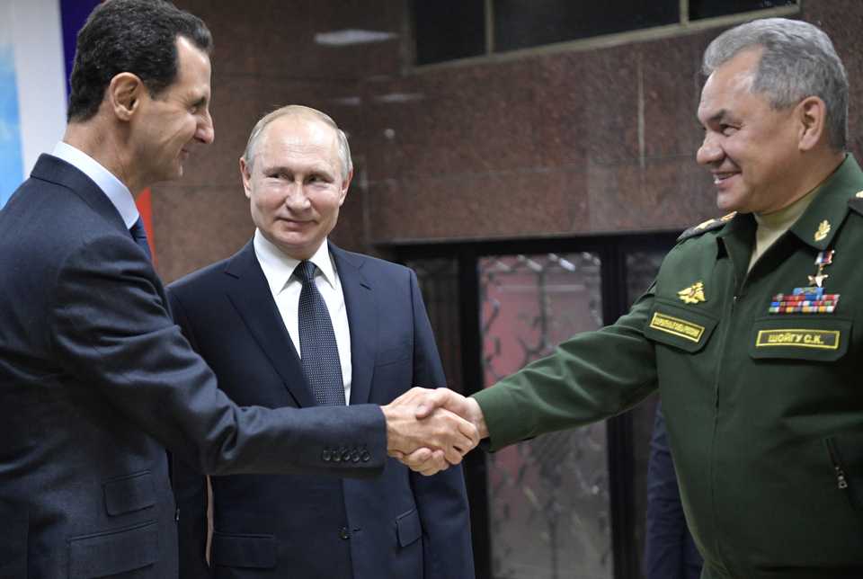 Russian President Vladimir Putin, Defence Minister Sergei Shoigu and Syrian President Bashar al-Assad attend a meeting in Damascus, Syria January 7, 2020.