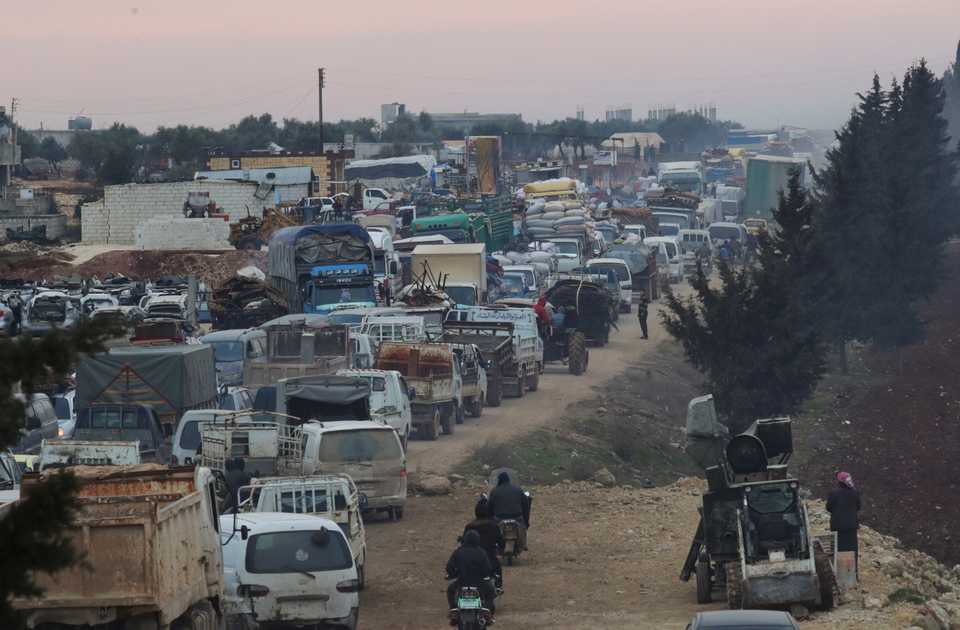 A general view of trucks carrying belongings of displaced Syrians, is pictured in the town of Sarmada in Idlib province, Syria, January 28, 2020.