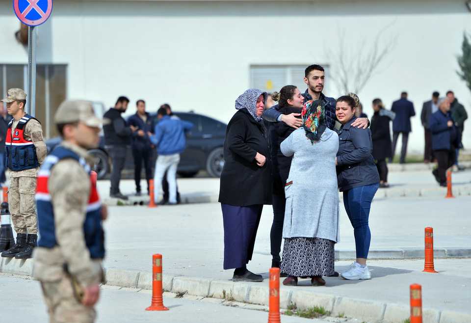 Families of Turkish soldiers fallen in the Syrian regime attack in Idlib console one another in Hatay, Turkey, on February 28, 2020.