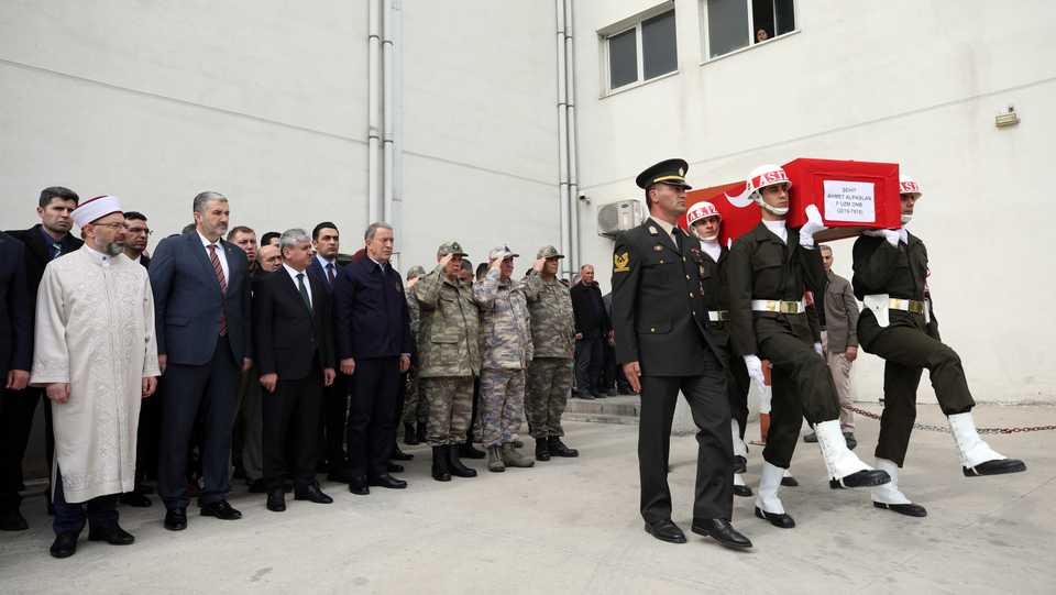 Turkey’s Defence Minister Hulusi Akar, accompanied by Turkish army officials, attends a ceremony on February 28, 2020, for soldiers killed in a Syrian regime attack.