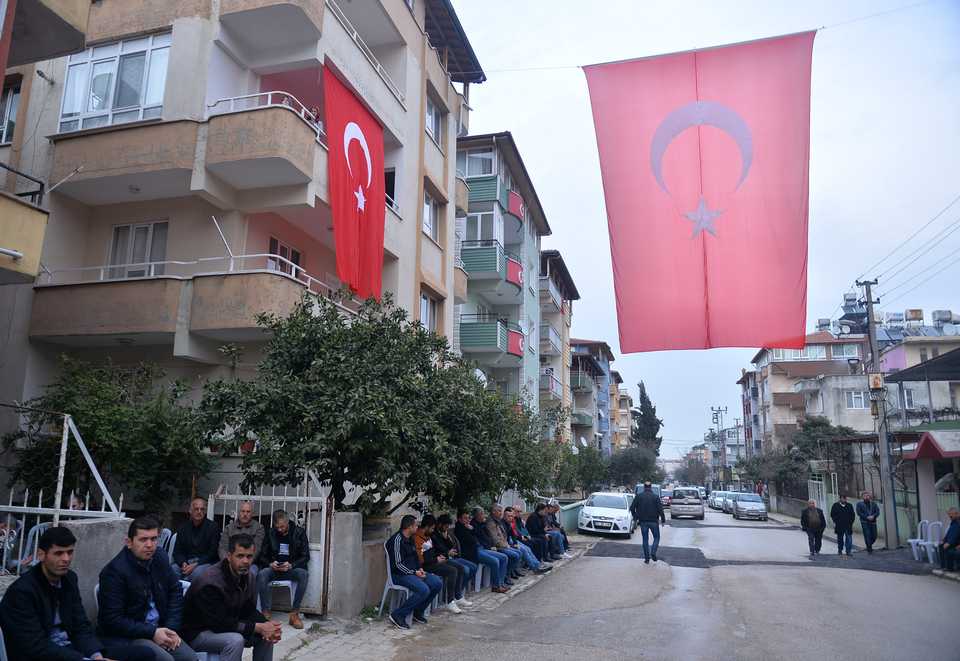 Turkish flags hung from homes of soldiers who died battling Syrian regime forces in Idlib.