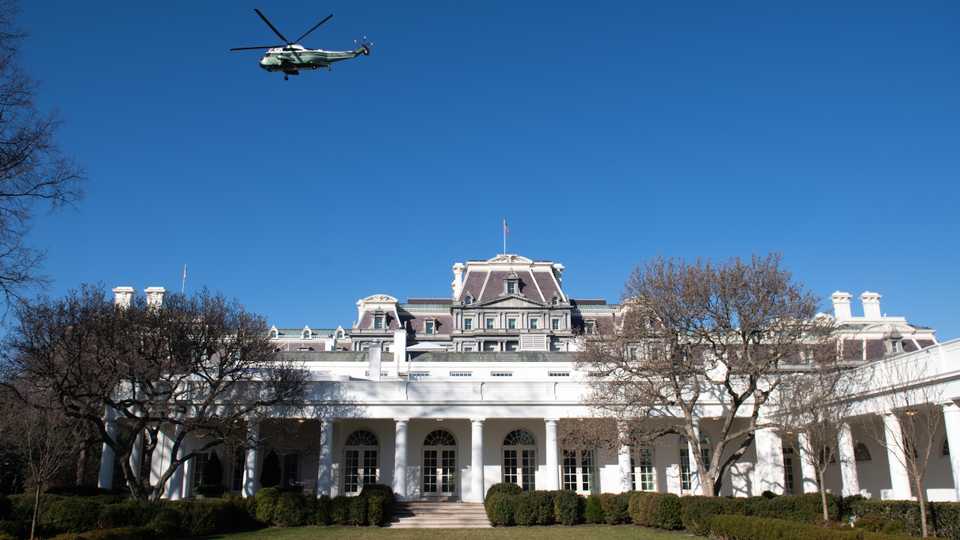 A backup helicopter to Marine One flies over the West Wing and Rose Garden of the White House in Washington, DC, February 23, 2020,