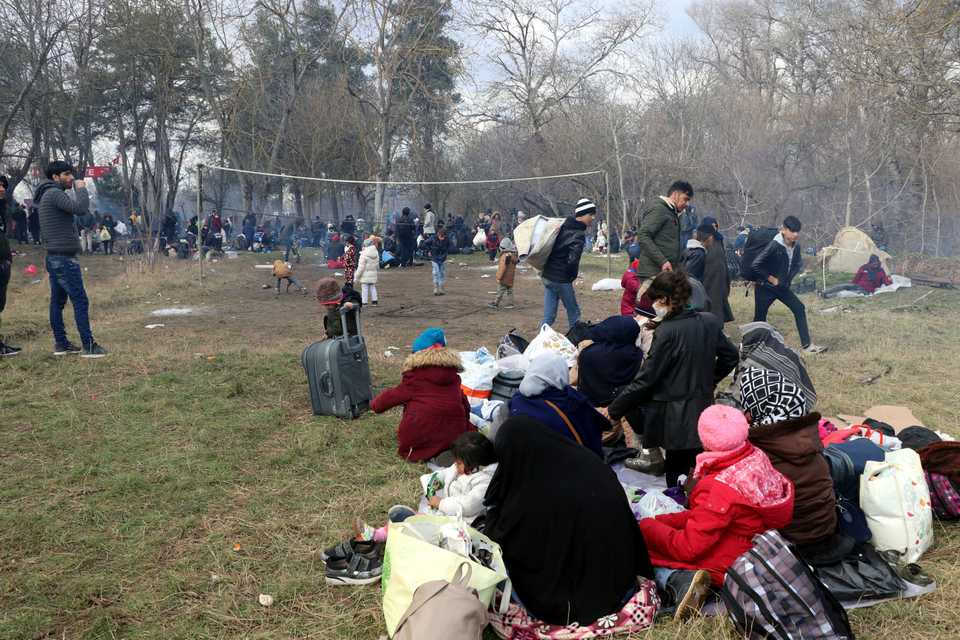 Children play where irregular migrants wait at Turkey's border with Greece in Edirne, Turkey on February 29, 2020. Irregular migrants, including women and children, have been heading towards border villages of the country’s western provinces of Edirne and Canakkale to reach Greece.