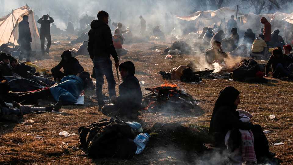 Migrants camp as they await to cross the border at Turkey's Pazarkule with Greece's Kastanies, in Edirne, Turkey on February 29, 2020.