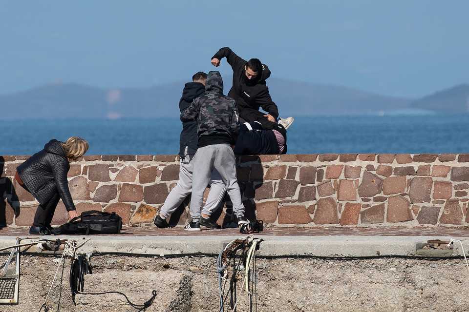 Locals who prevent migrants on a dinghy from disembarking at the port of Thermi beat a journalist on the island of Lesvos, Greece. March 1, 2020.