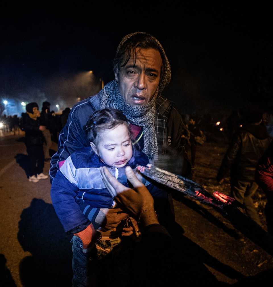 A baby in Edirne is being made to inhale smelled wood smoke in the belief it would decrease the impact of tear gas inhalation after Greek border guards attacked asylum seekers at the land border between Greece and Turkey on March 1, 2020.