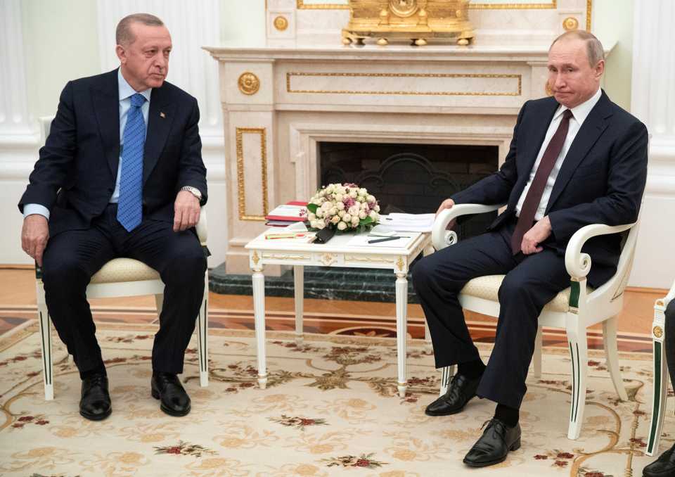 Turkish President Tayyip Erdogan and Russian President Vladimir Putin talk during a meeting in Moscow, Russia March 5, 2020.