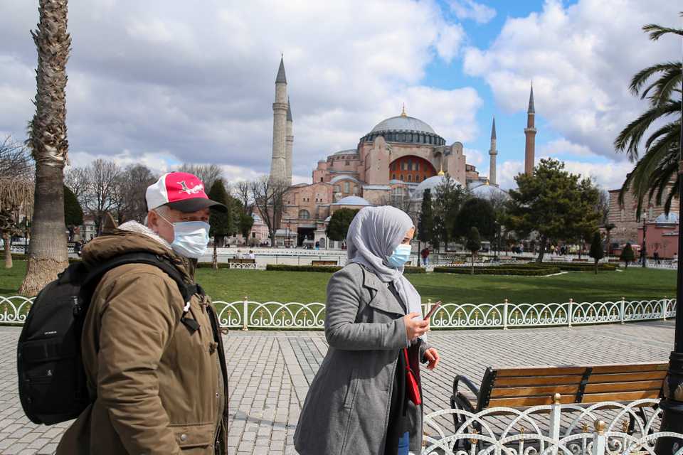 People near the Hagia Sophia museum in Istanbul wear face masks to prevent the spread of the Covid-19 virus.