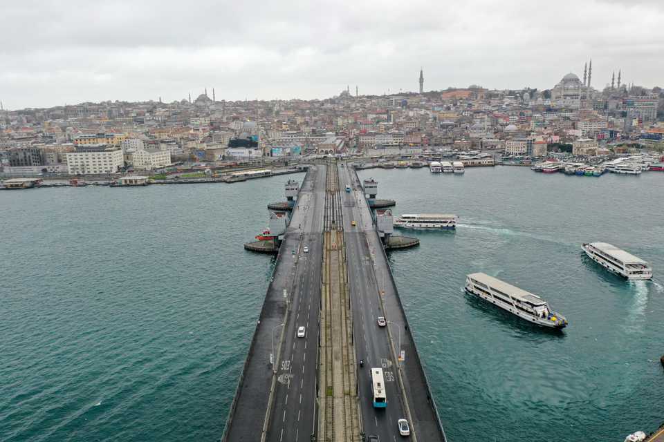 A drone photo shows an aerial view of empty Galata Bridge and its surroundings, after authorities urging people to stay home as part of coronavirus (COVID-19) precautions on March 24, 2020 in Istanbul, Turkey.