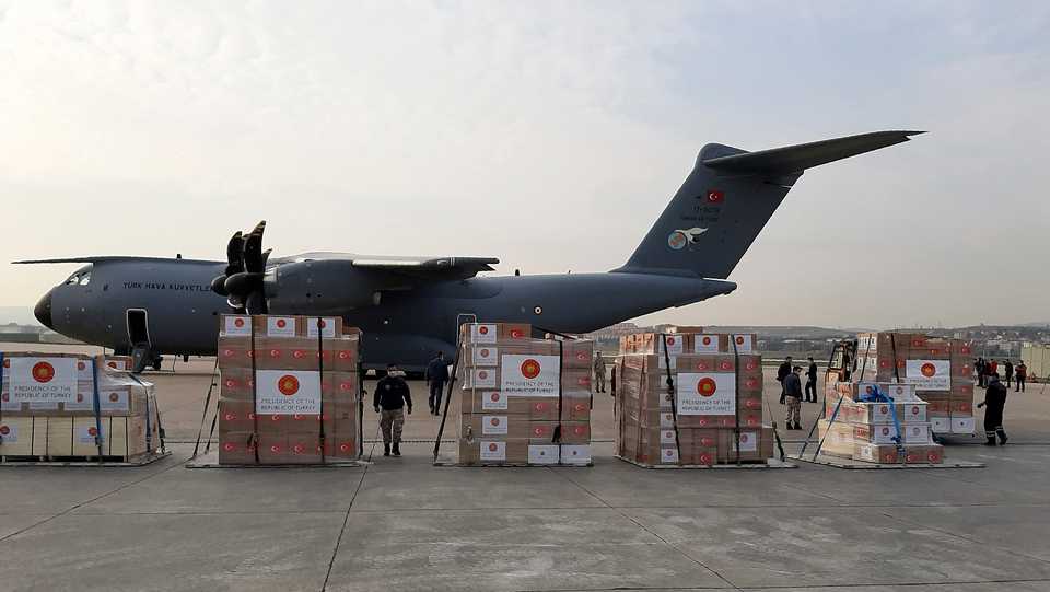 Soldiers prepare to load a military cargo plane with Personal Protection Equipment heading to Italy and Spain to help the countries combat the new coronavirus outbreak, in Ankara, Turkey on April 1, 2020.