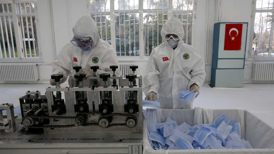 Workers make production of protective face masks against the spread of novel coronavirus pandemic at Mechanical and Chemical Industry Corporation's Mamak facility in Ankara, Turkey on April 2, 2020.