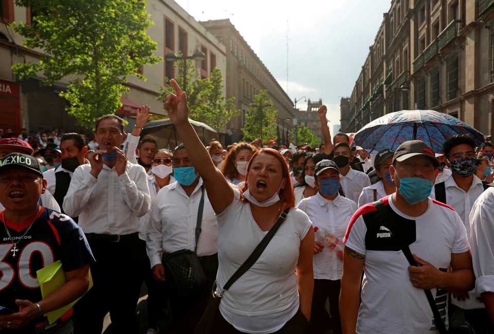Waiters take part in a protest outside the National Palace to demand the federal government help with the loss of jobs, after Mexico's government declared a health emergency and issued stricter rules to contain the spread of the coronavirus disease (Covid-19), in Mexico City, Mexico, April 5, 2020.