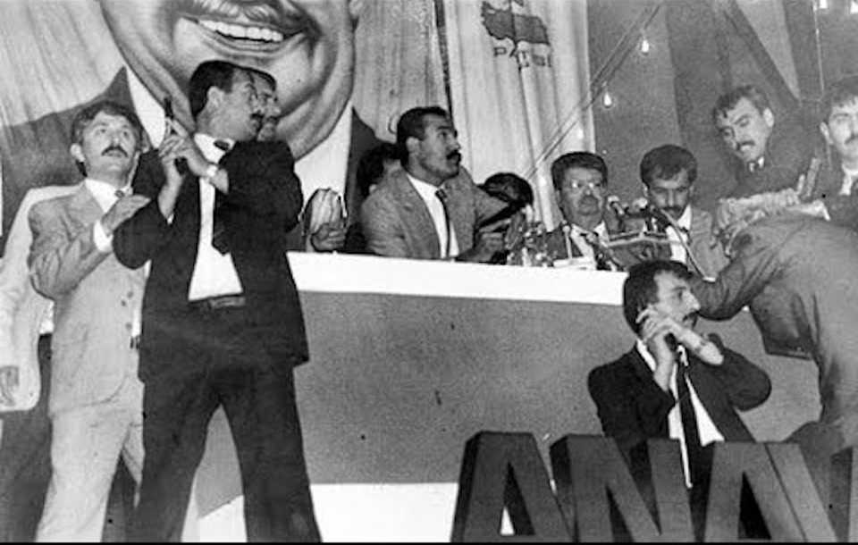 Ozal stands in the podium after a failed assassination attempt targeted his life during the Motherland Party congress on June 18, 1988.