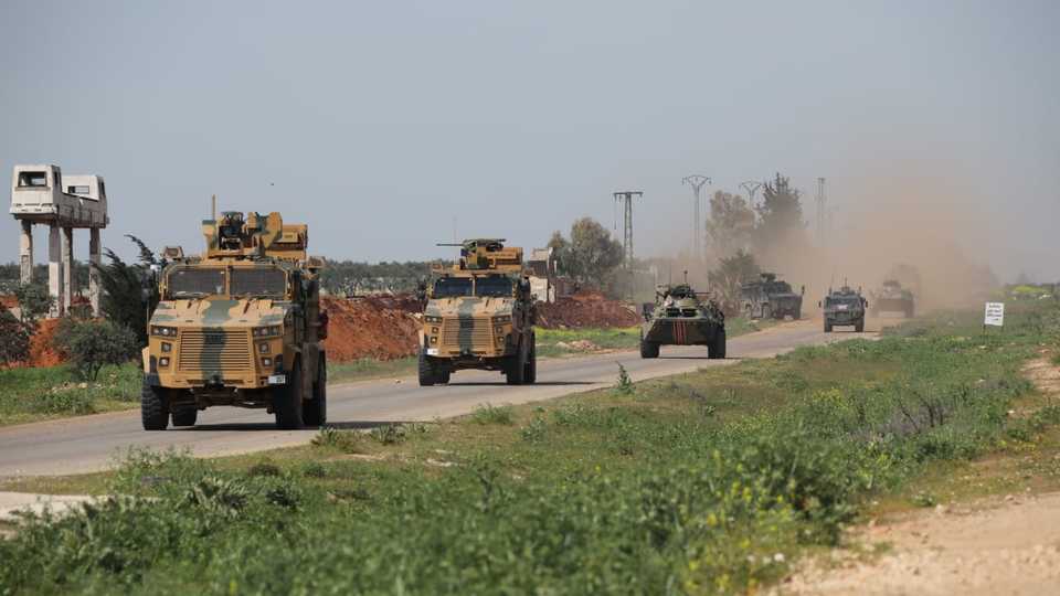 Turkish and Russian military vehicles take part in a joint patrol in the northern Idlib province, Syria, April 15, 2020.