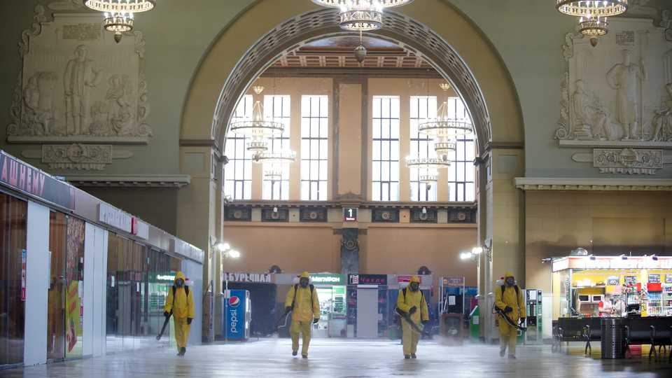 Members of the Russian Emergencies Ministry wearing protective gear spray disinfectant inside Kiyevsky railway station, following the outbreak of the coronavirus disease (Covid-19), in Moscow, Russia, April 22, 2020.