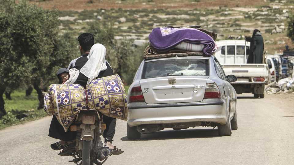 People return home after the cease-fire agreement for Syria's Idlib, along Turkey's southern border, reached by Turkey and Russia on April 17, 2020.