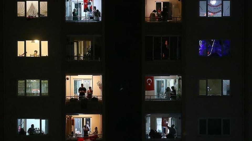 Turkish public takes place at balconies and windows to wave flags and sing national anthem.