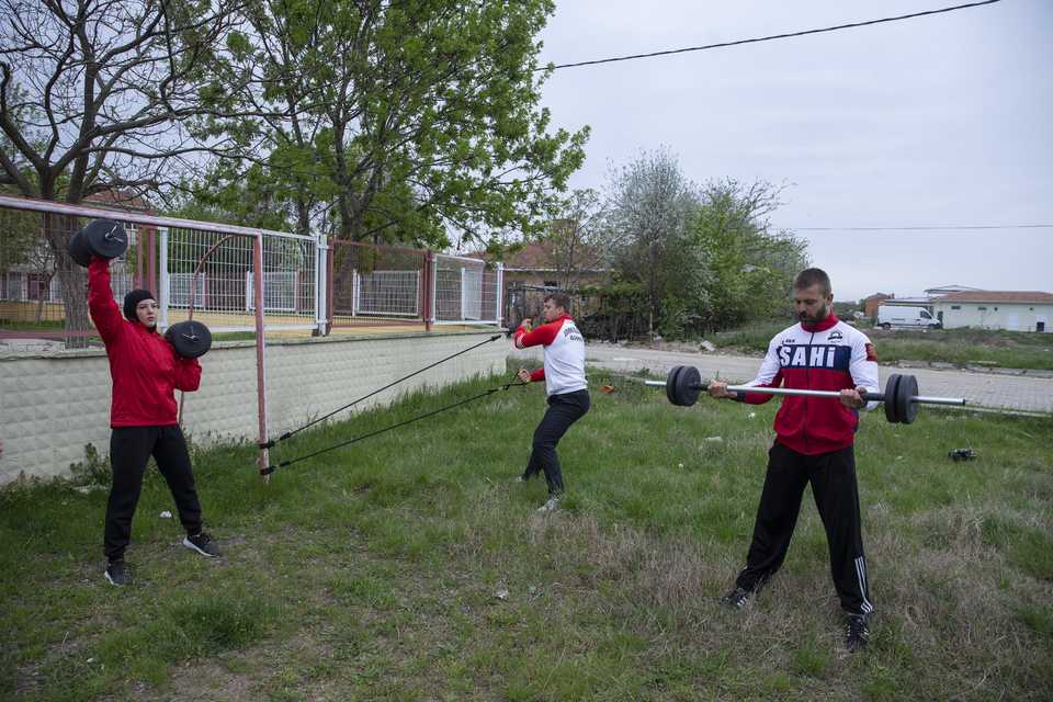 Wrestler siblings Elif , Ufuk and Safak Yanik are seen training at a land near their houses in Edirne, Turkey.