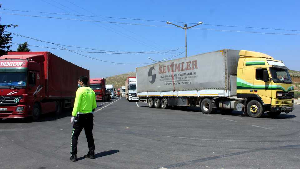 Trucks carrying goods are seen at Turkey's Cilvegozu border gate on April 14, 2020.