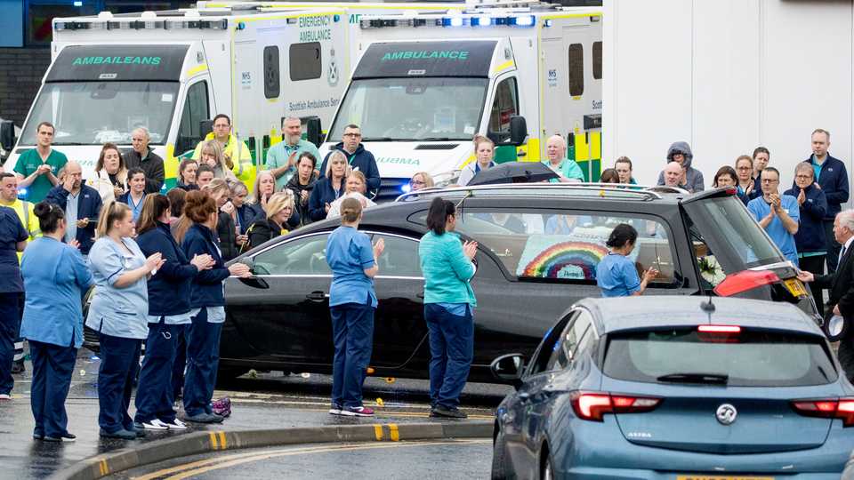 The funeral cortege of NHS worker Jane Murphy passes the Accident and Emergency department at the Edinburgh Royal Infirmary, in Edinburgh, Scotland, April 30, 2020.