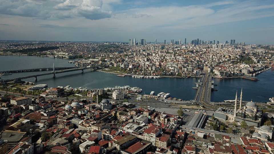 An aerial view taken on May 2, 2020 shows New mosque (R) and Galata bridge in Istanbul, during a three-day curfew to prevent the spread of the Covid-19 disease.