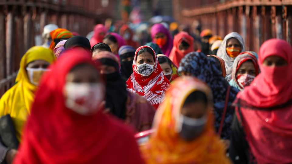 Garment workers return from a workplace as factories reopened after the government eased restrictions amid concerns over the coronavirus disease outbreak in Dhaka, Bangladesh, May 4, 2020.