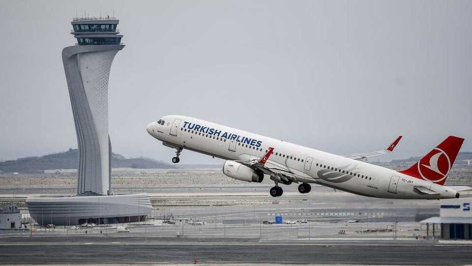 A Turkish Airlines plane takes off in front of the control tower at Istanbul Airport on April 6, 2019.