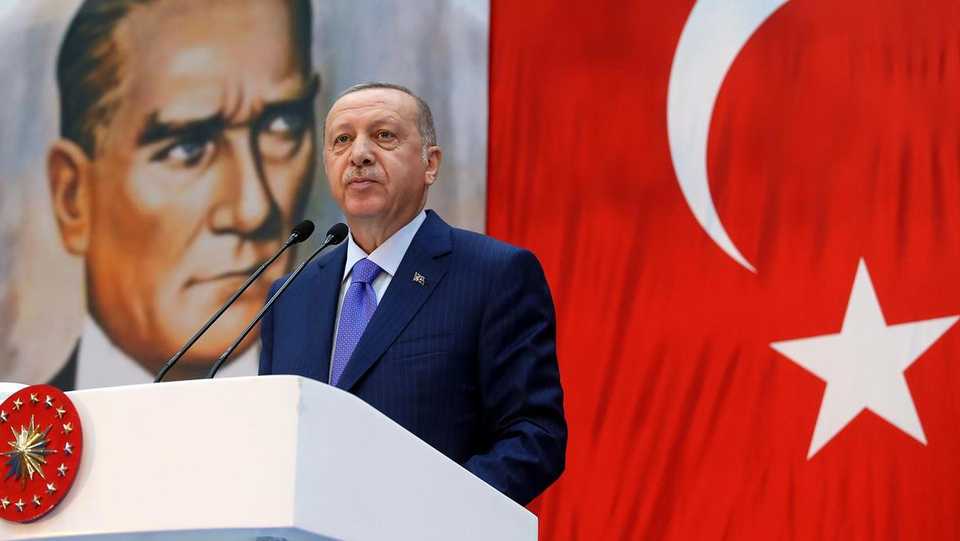 Turkey's President Recep Tayyip Erdogan, backdropped by a poster of modern Turkey's founder Mustafa Kemal Ataturk, speaks during a ceremony in Istanbul on Oct. 26, 2019.