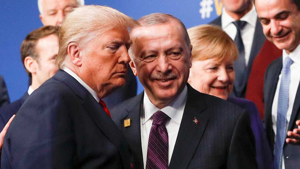 In this file photo, US President Donald Trump and Turkey's President Recep Tayyip Erdogan leave the stage after family photo during the annual NATO heads of government summit at the Grove Hotel in Watford, Britain December 4, 2019.