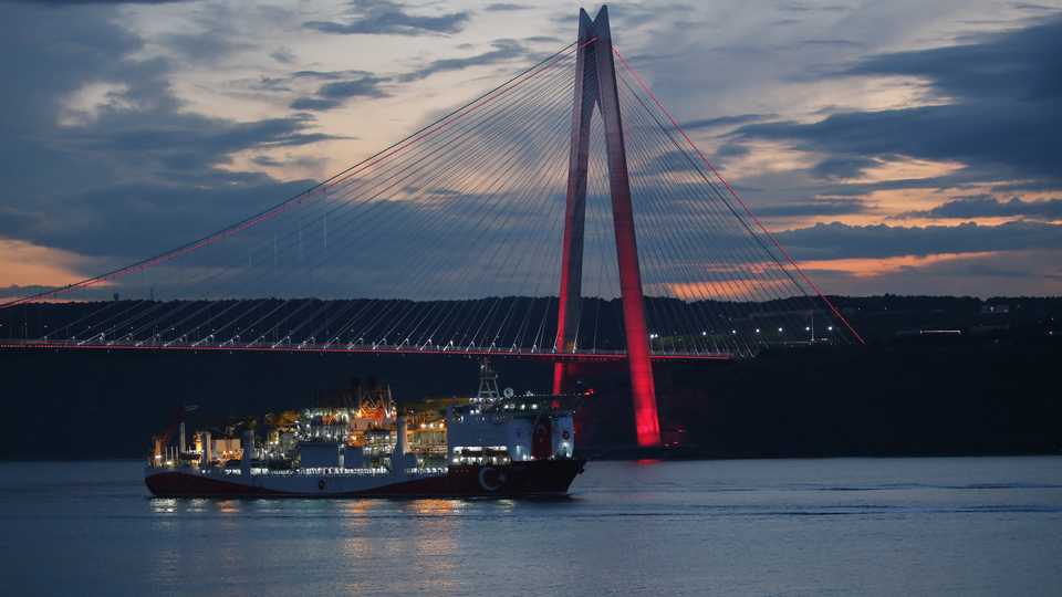A photo shows Turkish drilling vessel 'Fatih' passing under the Yavuz Sultan Selim Bridge as it is on the way, in Istanbul, Turkey on May 29, 2020.