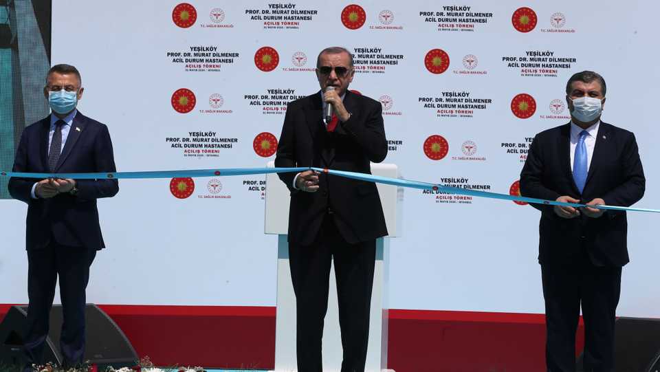 Turkish President Recep Tayyip Erdogan (C), Turkish Vice President Fuat Oktay (L) and Turkish Health Minister Fahrettin Koca (R) cut the ribbon as they attend the opening ceremony of Yesilkoy Prof Dr Murat Dilmener Emergency Hospital in Istanbul, Turkey on May 31, 2020.