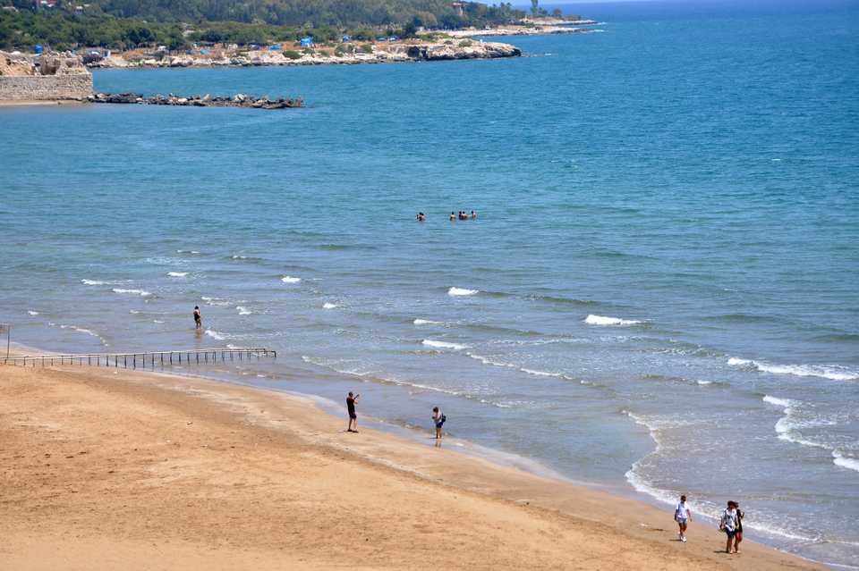 People enjoy their time at a beach after parks, gardens, picnic and recreational areas, hiking and fishing, as well as beaches reopened as authorities took a set of new decisions to ease restrictions due to the novel coronavirus as the country made advances in its fight against the pandemic in Mersin, Turkey on June 1, 2020.