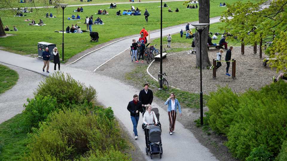 People enjoy a spring day at the Ralambshov park during the coronavirus outbreak in Stockholm, Sweden, May 8, 2020. Henrik Montgomery /via TT News Agency.