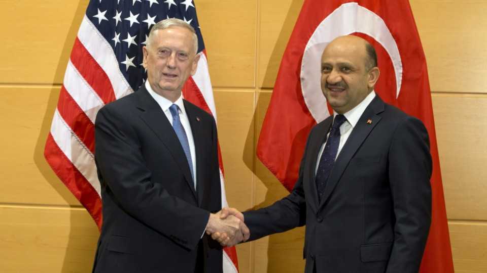 US Secretary of Defense Jim Mattis, left, speaks with Turkish Defense Minister Fikri Isik during a meeting at NATO headquarters in Brussels on Wednesday, February 15, 2017. 