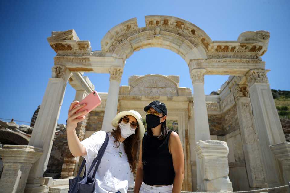 Visitors are seen as they take a tour around the remains of the ancient city of Ephesus in Izmir, Turkey on June 10, 2020.