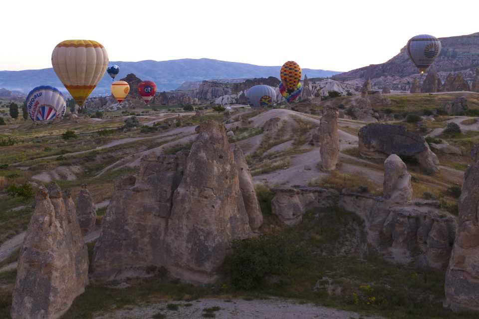 Hot air balloons glide over the Cappadocia region during test flights, in Nevsehir, Turkey on June 5, 2020.