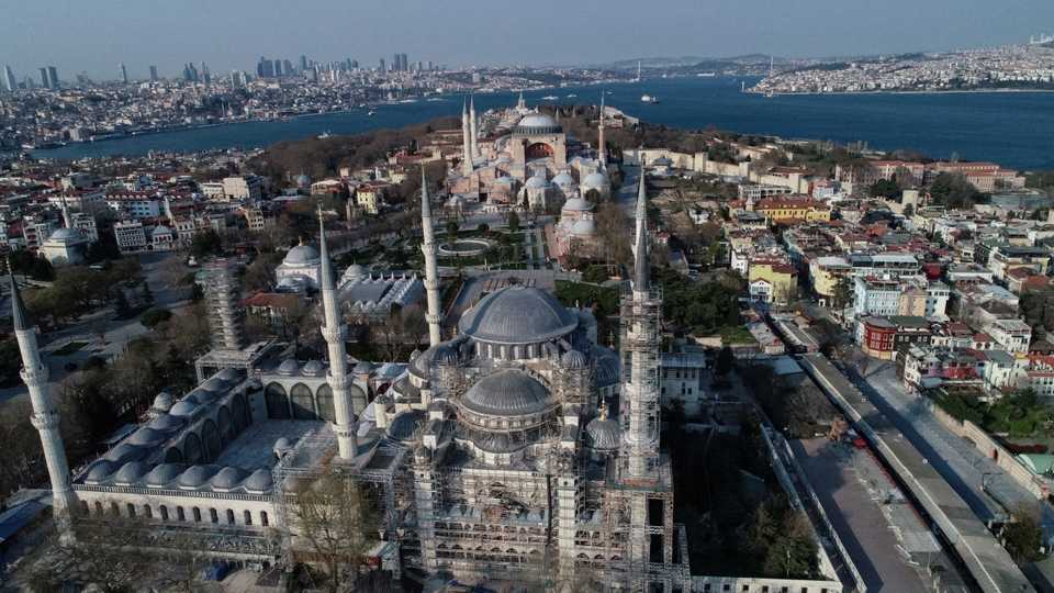 An aerial view shows the Hagia Sophia in the distance and the Blue Mosque in front of it in Istanbul, Turkey, April 11, 2020.