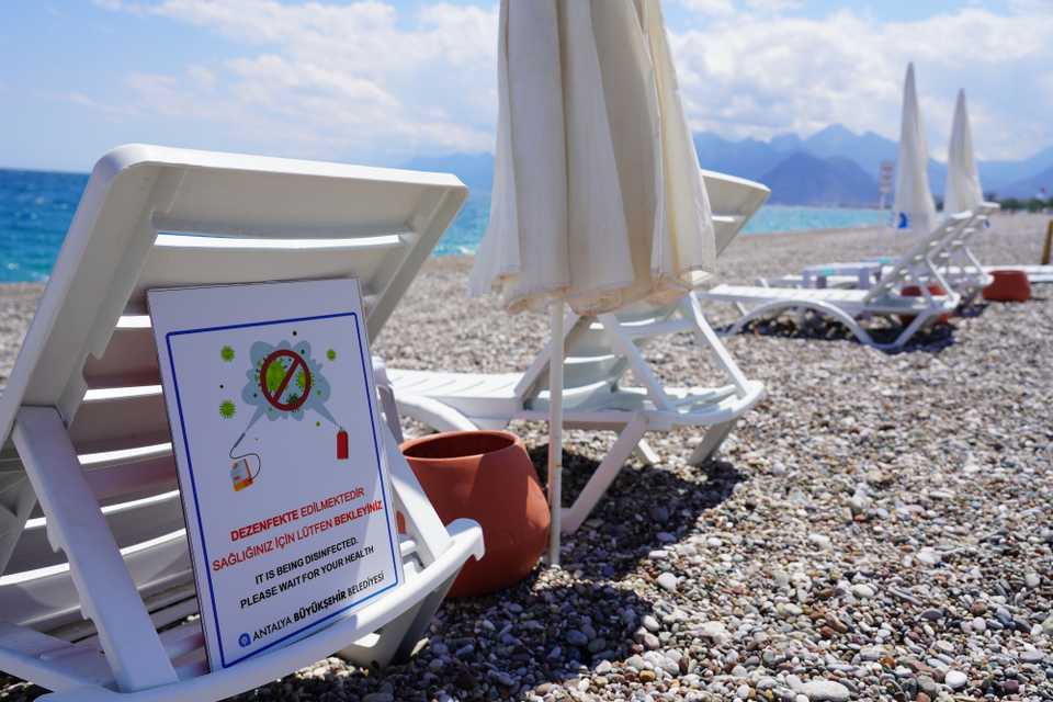 Beach chairs and tables are being disinfected for the health of visitors, Antalya, Turkey.