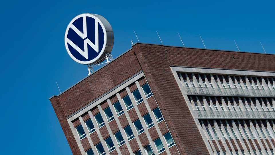 FILE - In this Monday, April 27, 2020. file photo, The Volkswagen logo stand on the top of a VW headquarters building in Wolfsburg, Germany.