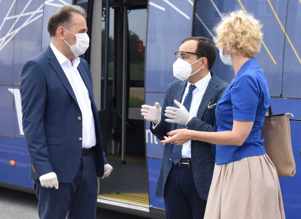 Turkish and Serbian officials wait for a Turkish cargo plane carrying a second batch of medical supplies at the Nikola Tesla Airport in Belgrade, Serbia on July 4, 2020.
