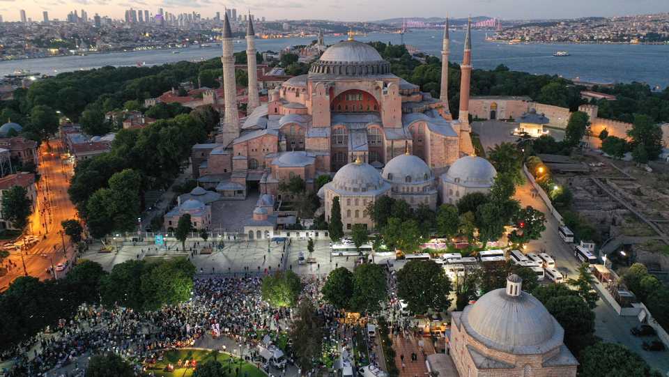 A drone photo shows people performing the evening prayer at Ayasofya (Hagia Sophia) Square in Istanbul, Turkey on July 10, 2020.