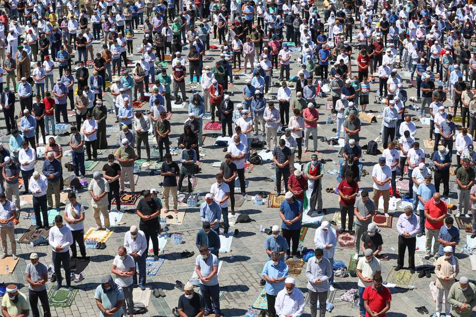 People perform Friday Prayer for the first time after 86 years outside of the Hagia Sophia Mosque on July 24, 2020 in Istanbul, Turkey.