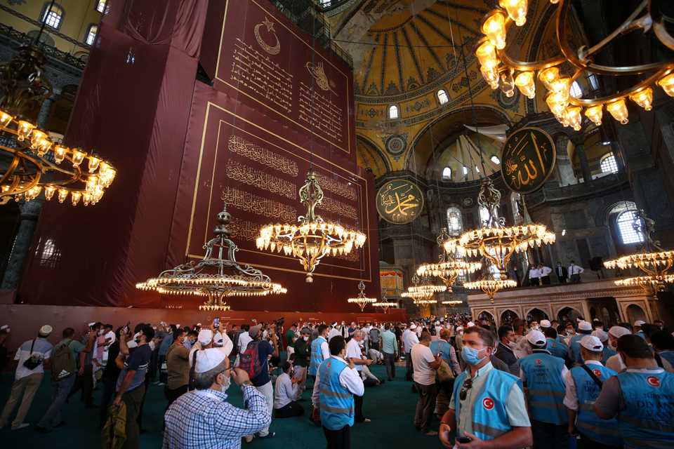 People walk inside Hagia Sophia Grand Mosque and take pictures in Istanbul, Turkey on July 24, 2020.