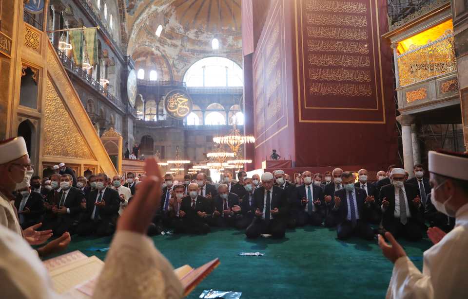 Turkish President Recep Tayyip Erdogan, accompanied by other top officials and Nationalist Movement Party (MHP) leader Devlet Bahceli, prays at the Hagia Sophia Mosque on July 24, 2020 in Istanbul, Turkey.