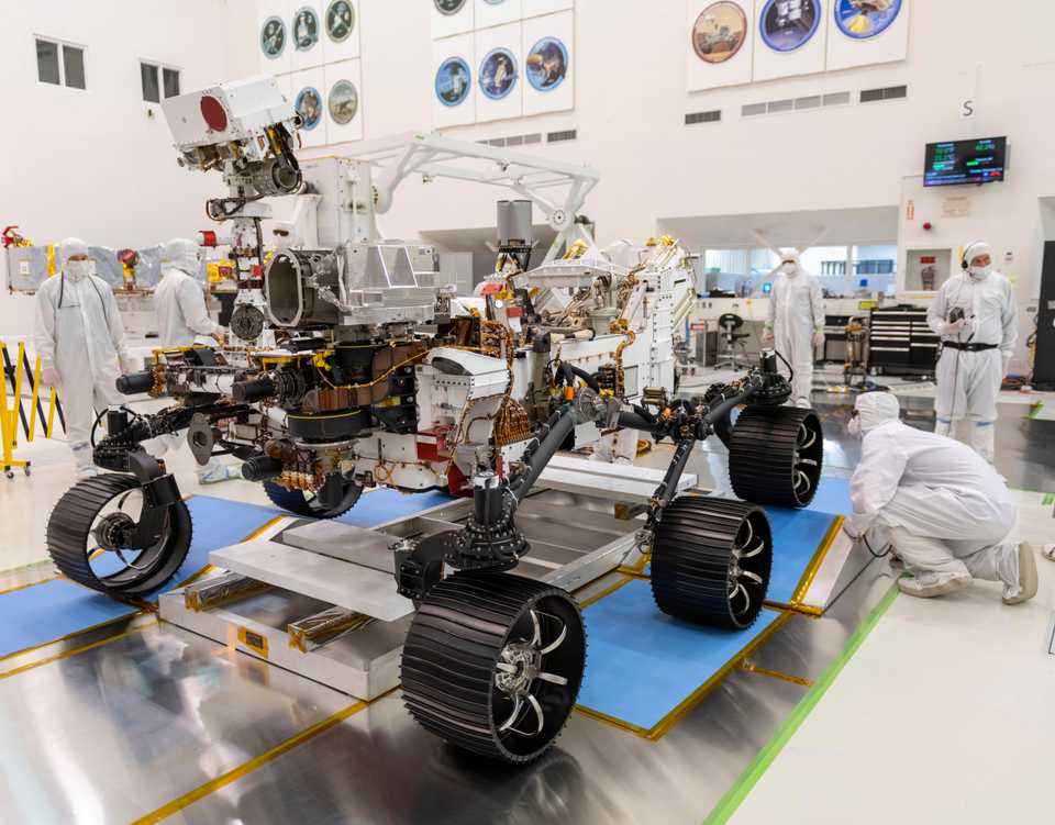 In this December 17, 2019 photo made available by NASA, engineers monitor a driving test for the Mars rover Perseverance in a clean room at the Jet Propulsion Laboratory in Pasadena, California, US.