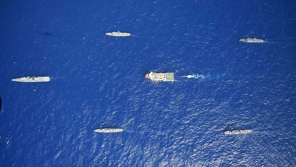 This handout photograph released by the Turkish Defence Ministry on August 12, 2020, shows Turkish seismic research vessel Oruc Reis (C) escorted by Turkish Naval ships in the Mediterranean Sea off Antalya on August 10, 2020.