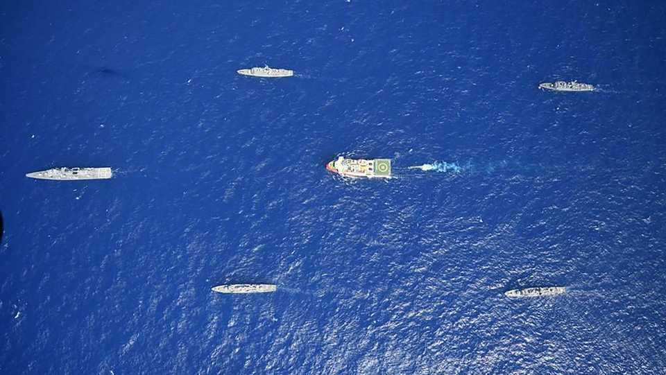 This handout photograph released by the Turkish Defence Ministry on August 12, 2020, shows Turkish seismic research vessel Oruc Reis (C) escorted by Turkish Naval ships in the Mediterranean Sea off Antalya on August 10, 2020.