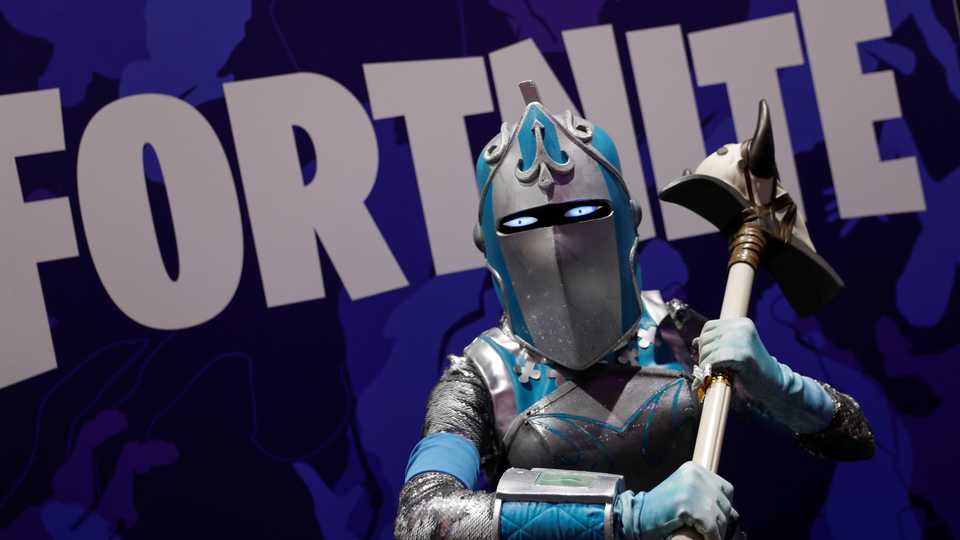 An attendee dressed as a Fortnite character poses for a picture in a costume at Comic Con International in San Diego, California, US, July 19, 2019.