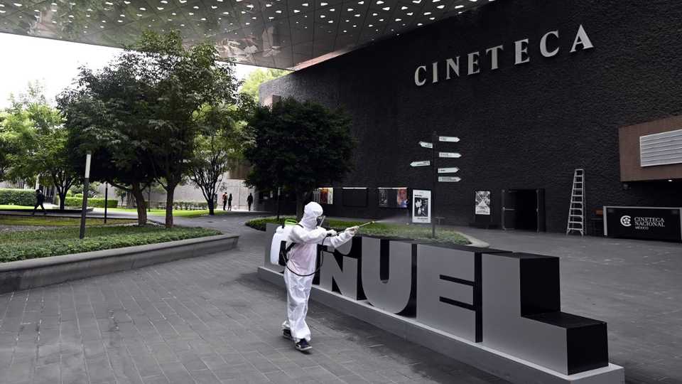 A worker sanitises an area of the Cineteca Nacional in Mexico City, on August 12, 2020.